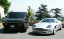 Essai Passion/ Aston Martin Vanquish vs Hummer H2 : duel aux antipodes